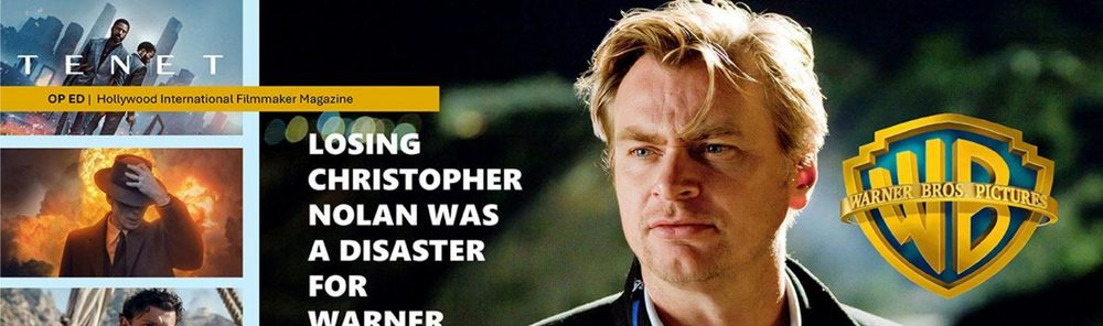 Christopher Nolan beside the Warner Bros. shield